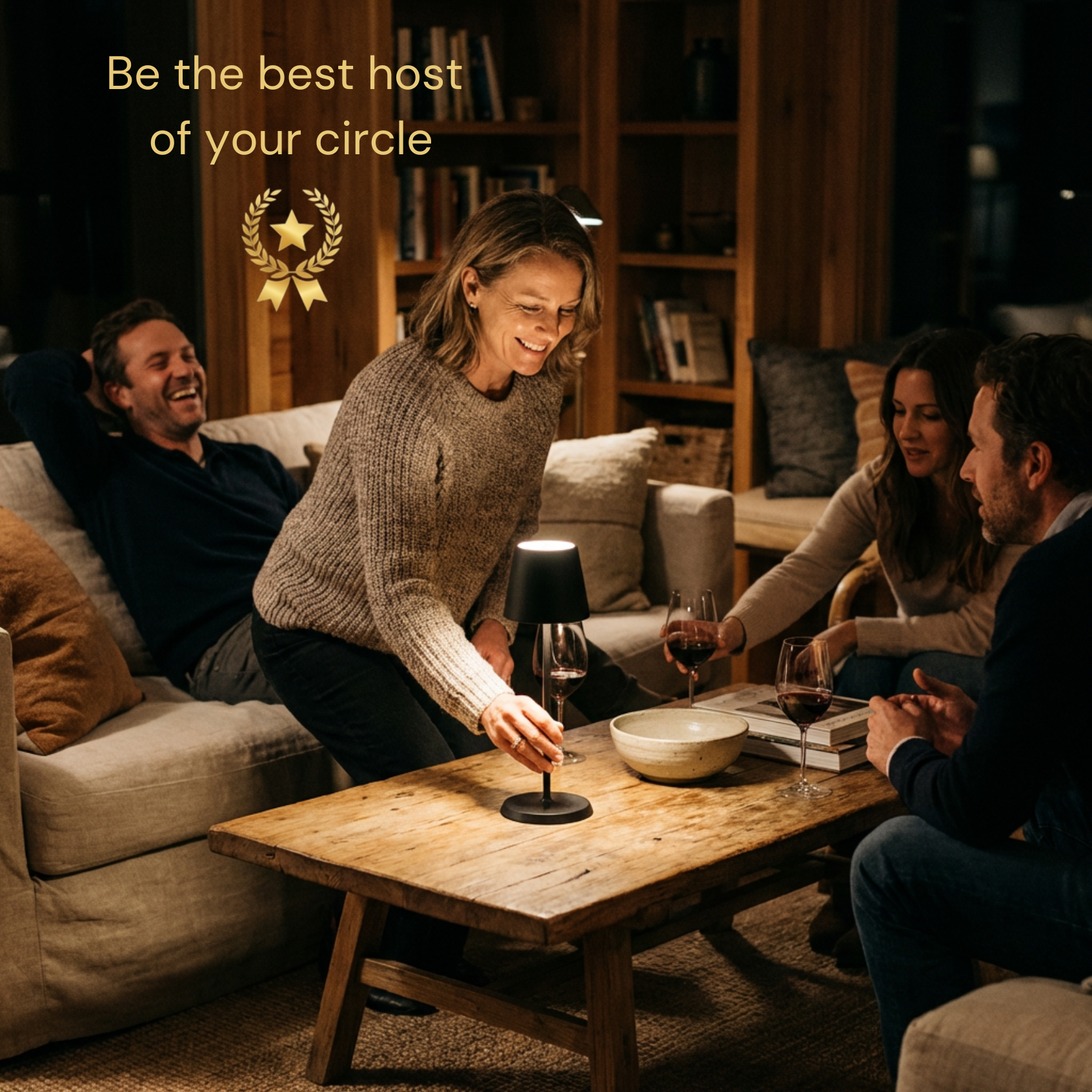 Selene Table Lamp in black, enhancing a cozy gathering with friends around a wooden table.